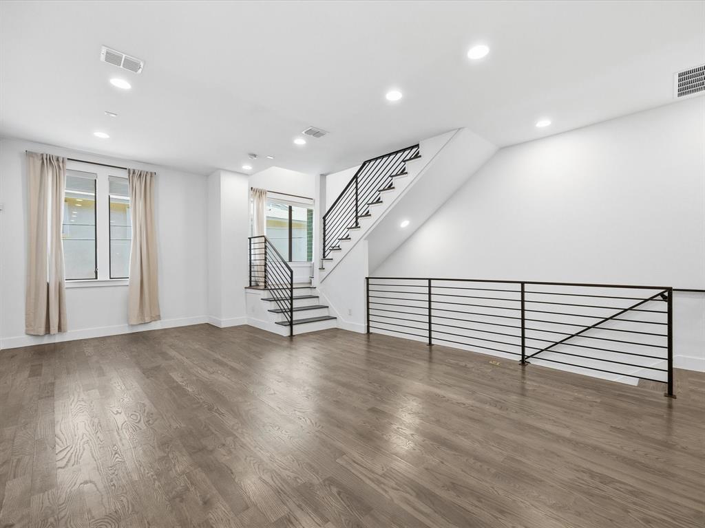 1920 Dowgate Court Dallas, TX 75204 - Photo 11 of 38 Unfurnished living room featuring recessed lighting and wood finished floors