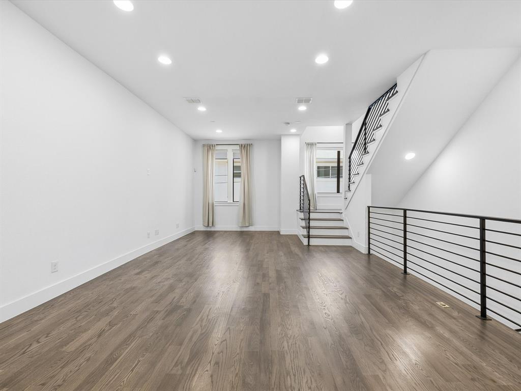 1920 Dowgate Court Dallas, TX 75204 - Photo 12 of 38 Unfurnished living room with recessed lighting and dark wood-type flooring