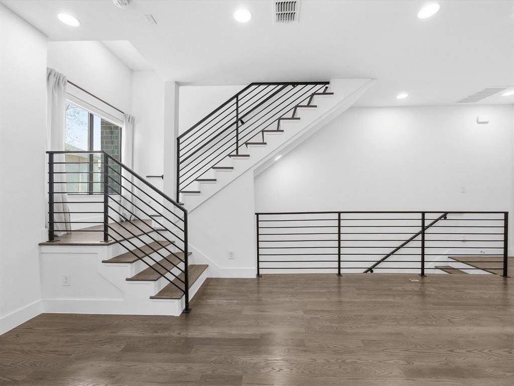 1920 Dowgate Court Dallas, TX 75204 - Photo 17 of 38 Stairway with wood finished floors and recessed lighting
