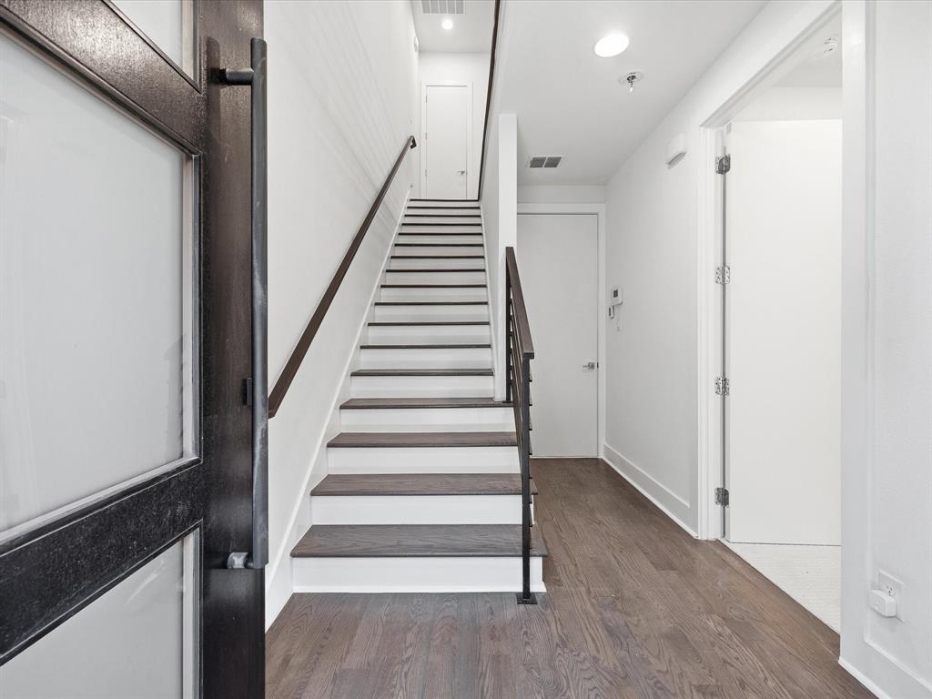1920 Dowgate Court Dallas, TX 75204 - Photo 2 of 38 Stairway featuring wood finished floors and recessed lighting