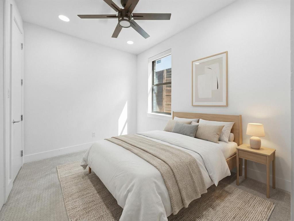 1920 Dowgate Court Dallas, TX 75204 - Photo 21 of 38 Bedroom with light carpet, a ceiling fan, and recessed lighting