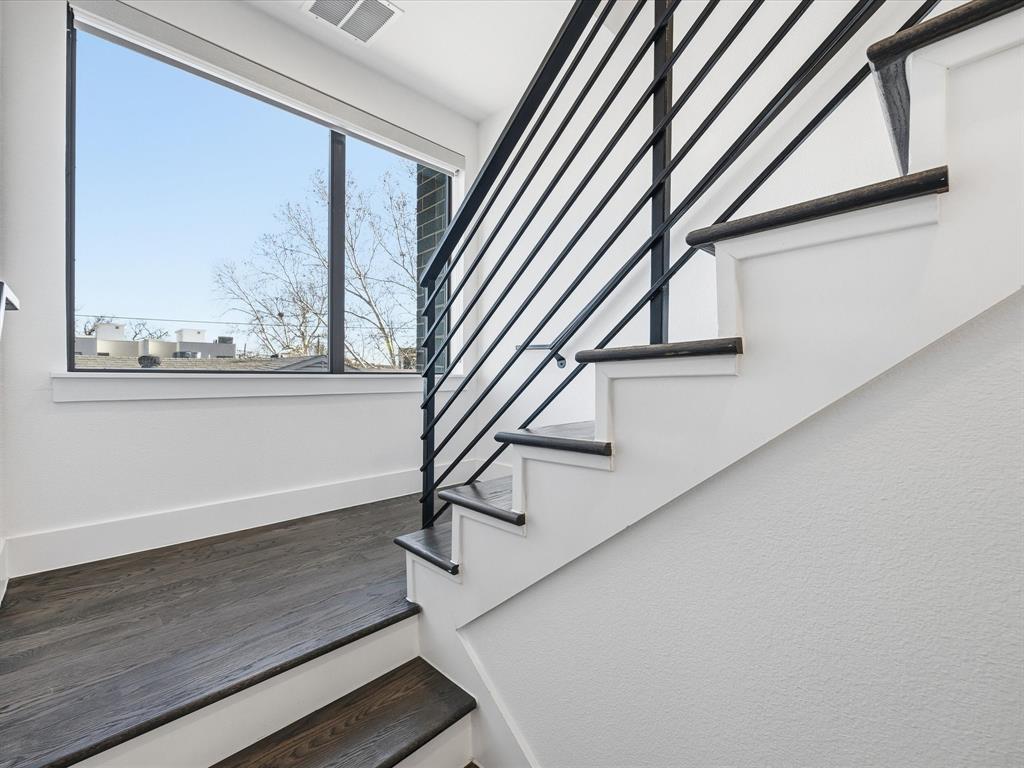 1920 Dowgate Court Dallas, TX 75204 - Photo 25 of 38 Staircase with baseboards and wood finished floors