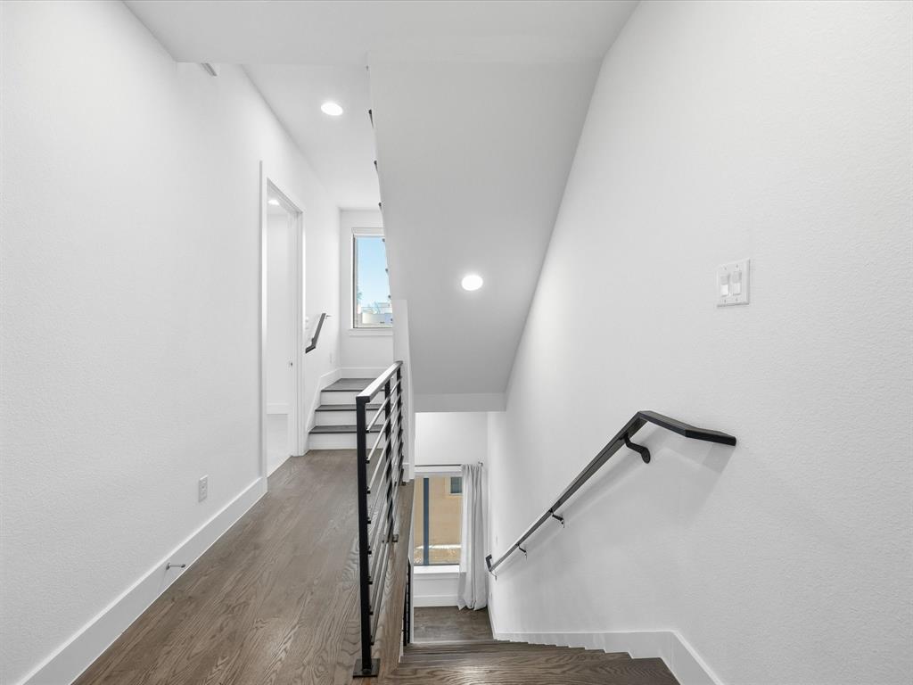 1920 Dowgate Court Dallas, TX 75204 - Photo 26 of 38 Stairway with wood finished floors and recessed lighting
