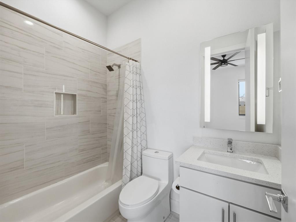 1920 Dowgate Court Dallas, TX 75204 - Photo 5 of 38 Bathroom featuring vanity and shower / bath combo