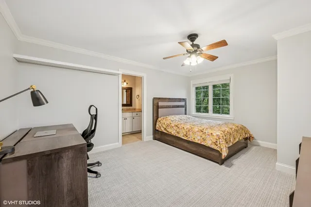 a bedroom with a bed closet and window