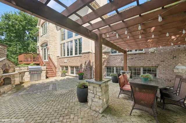 a view of a patio with chairs and tables