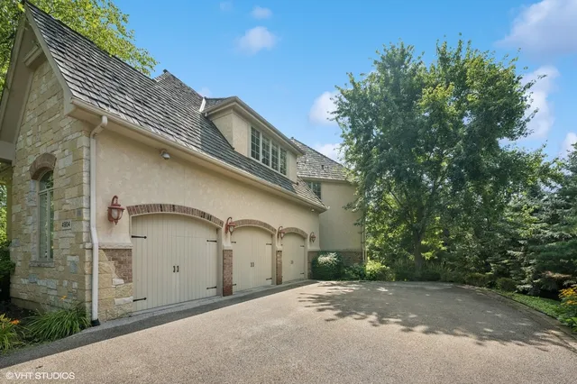 a front view of a house with a garage