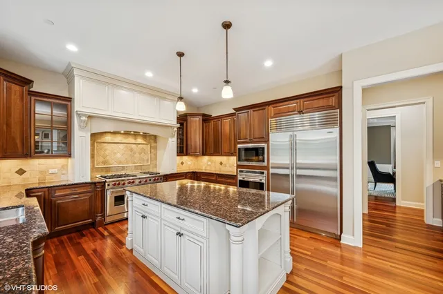 a kitchen with a stove sink and refrigerator