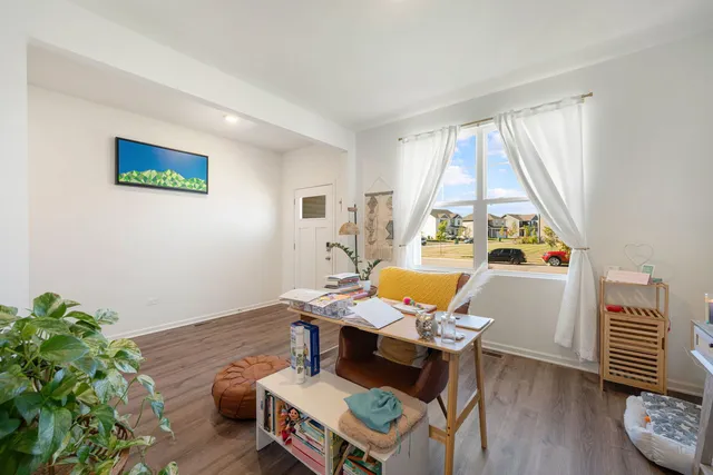 a workspace with furniture and a window