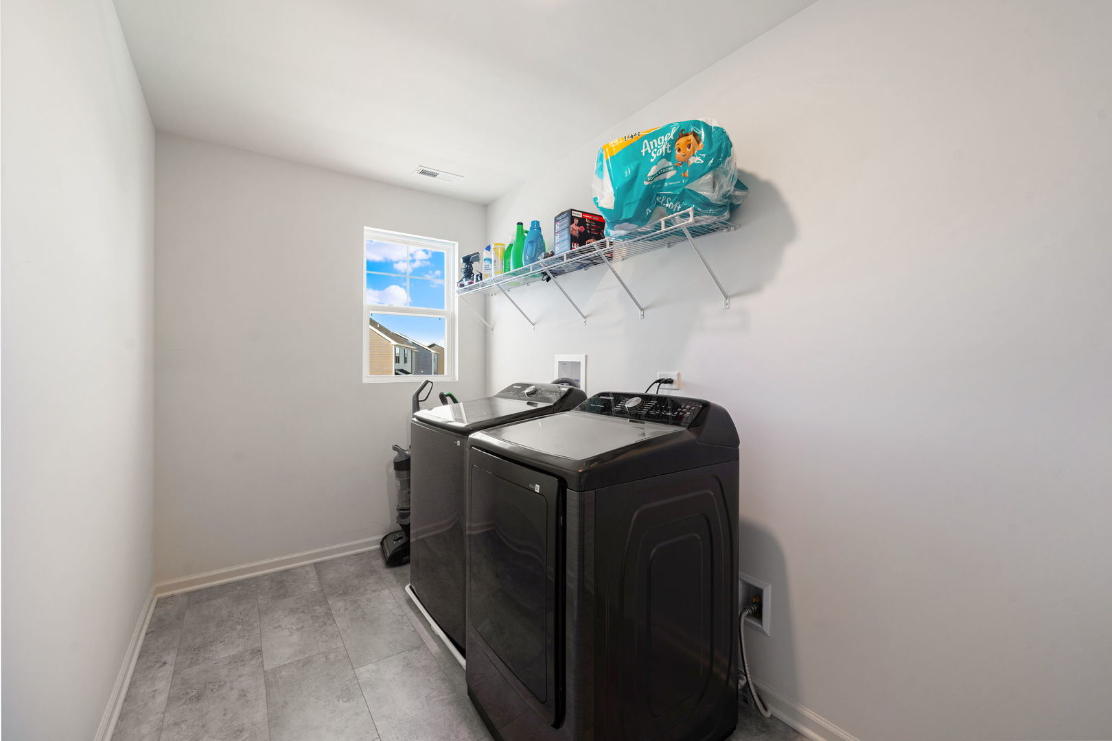 2042 Legacy Pointe Boulevard Plainfield, IL 60586 - Photo 14 of 20 a utility room with a sink a mirror and window