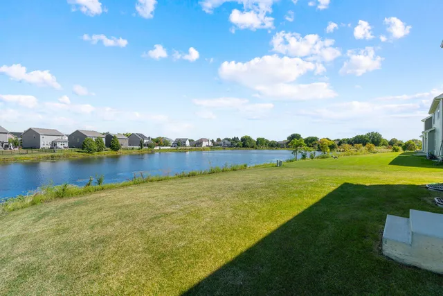 a view of a lake with houses in the back