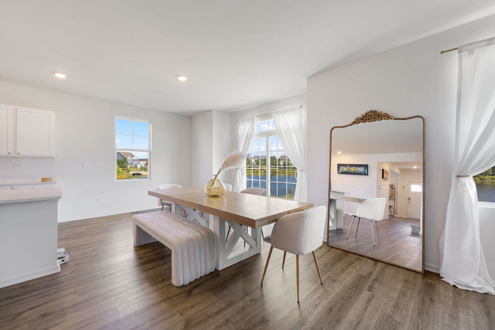 2042 Legacy Pointe Boulevard Plainfield, IL 60586 - Photo 5 of 20 a view of a dining room with furniture window and wooden floor