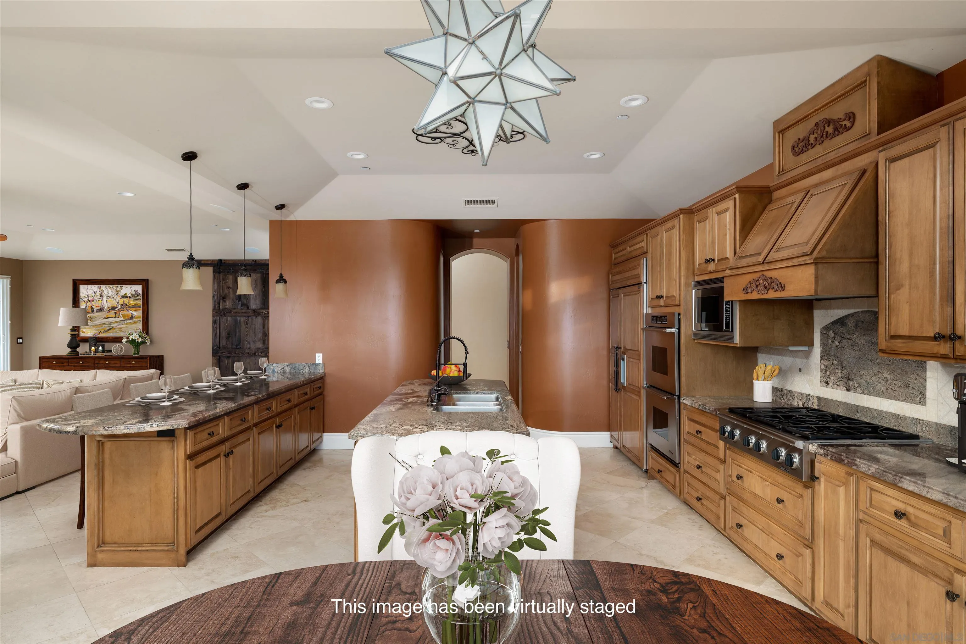 14755 High Valley Road Poway, CA 92064 - Photo 13 of 59 a kitchen with stainless steel appliances granite countertop a stove a sink dishwasher a dining table and chairs with wooden floor