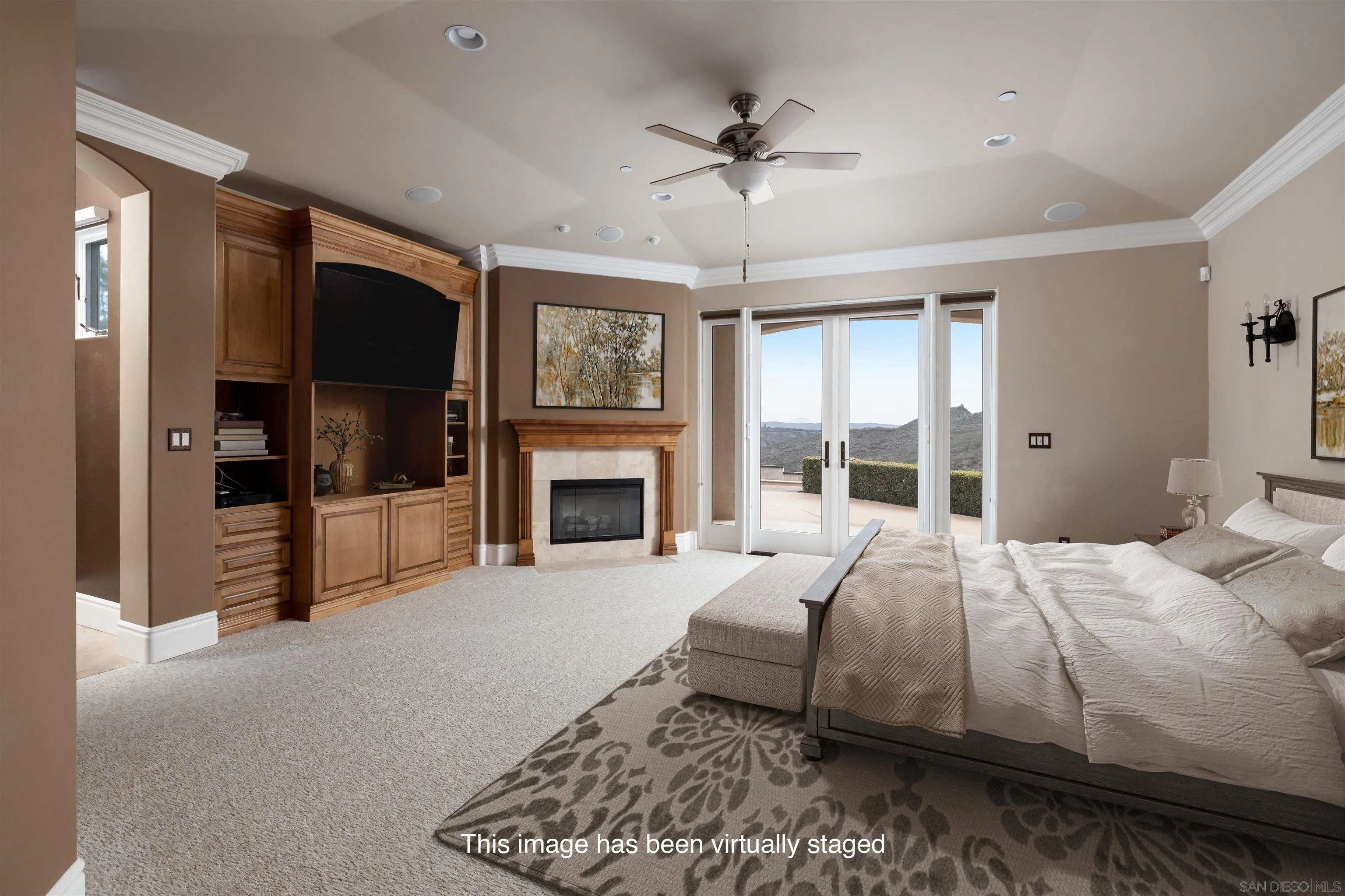14755 High Valley Road Poway, CA 92064 - Photo 17 of 59 a spacious bedroom with a large bed and a fireplace