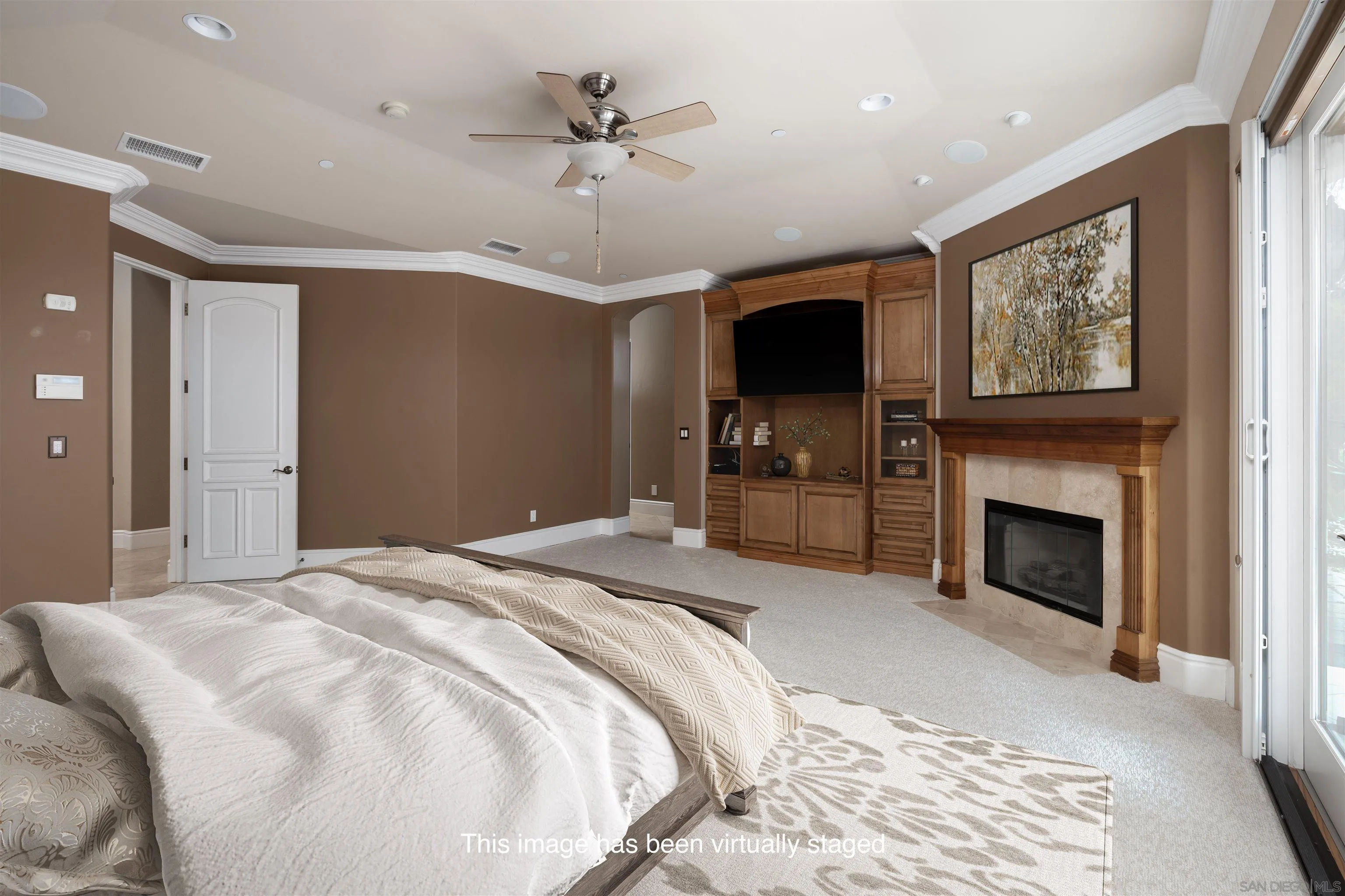 14755 High Valley Road Poway, CA 92064 - Photo 18 of 59 a spacious bedroom with a large bed a flat tv screen and a fireplace