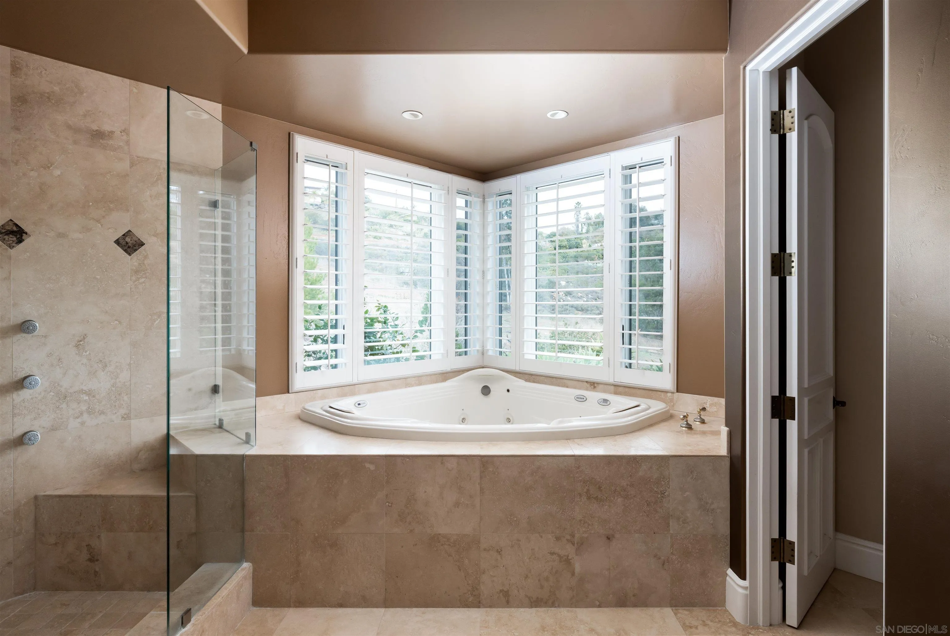 14755 High Valley Road Poway, CA 92064 - Photo 20 of 59 a bath tub sitting in a bathroom next to a window