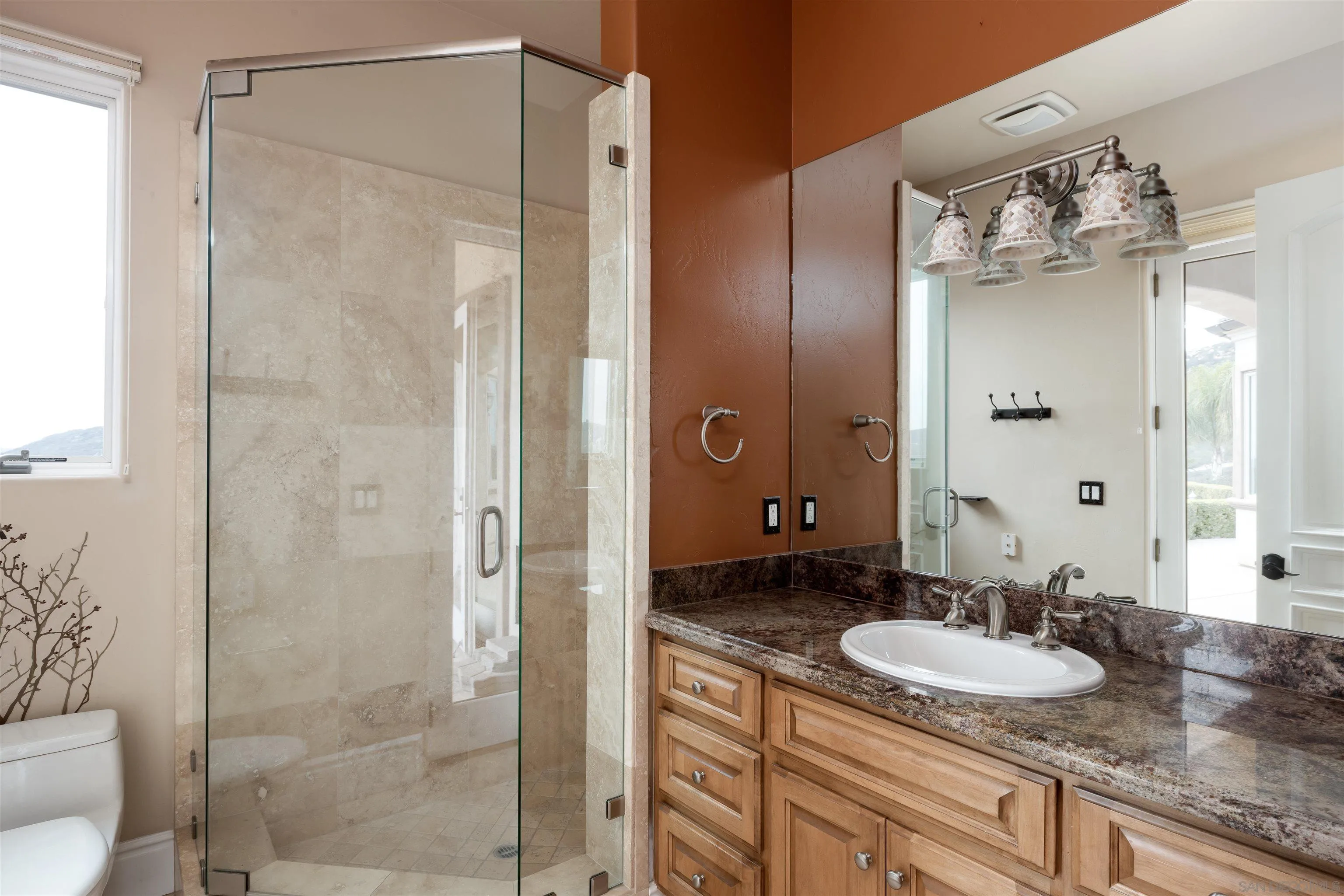 14755 High Valley Road Poway, CA 92064 - Photo 23 of 59 a bathroom with a granite countertop shower sink and mirror