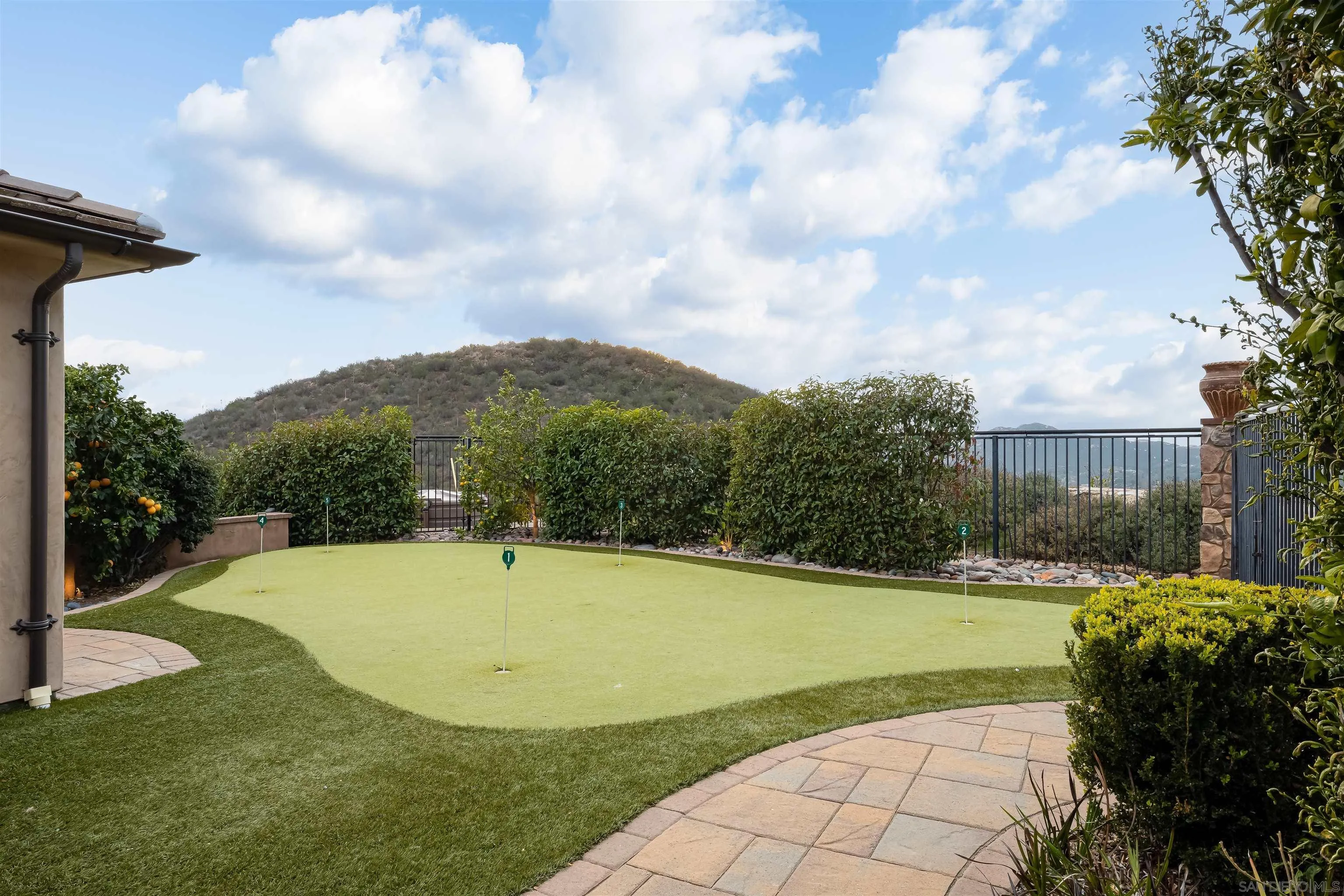 14755 High Valley Road Poway, CA 92064 - Photo 38 of 59 a view of a swimming pool with a yard