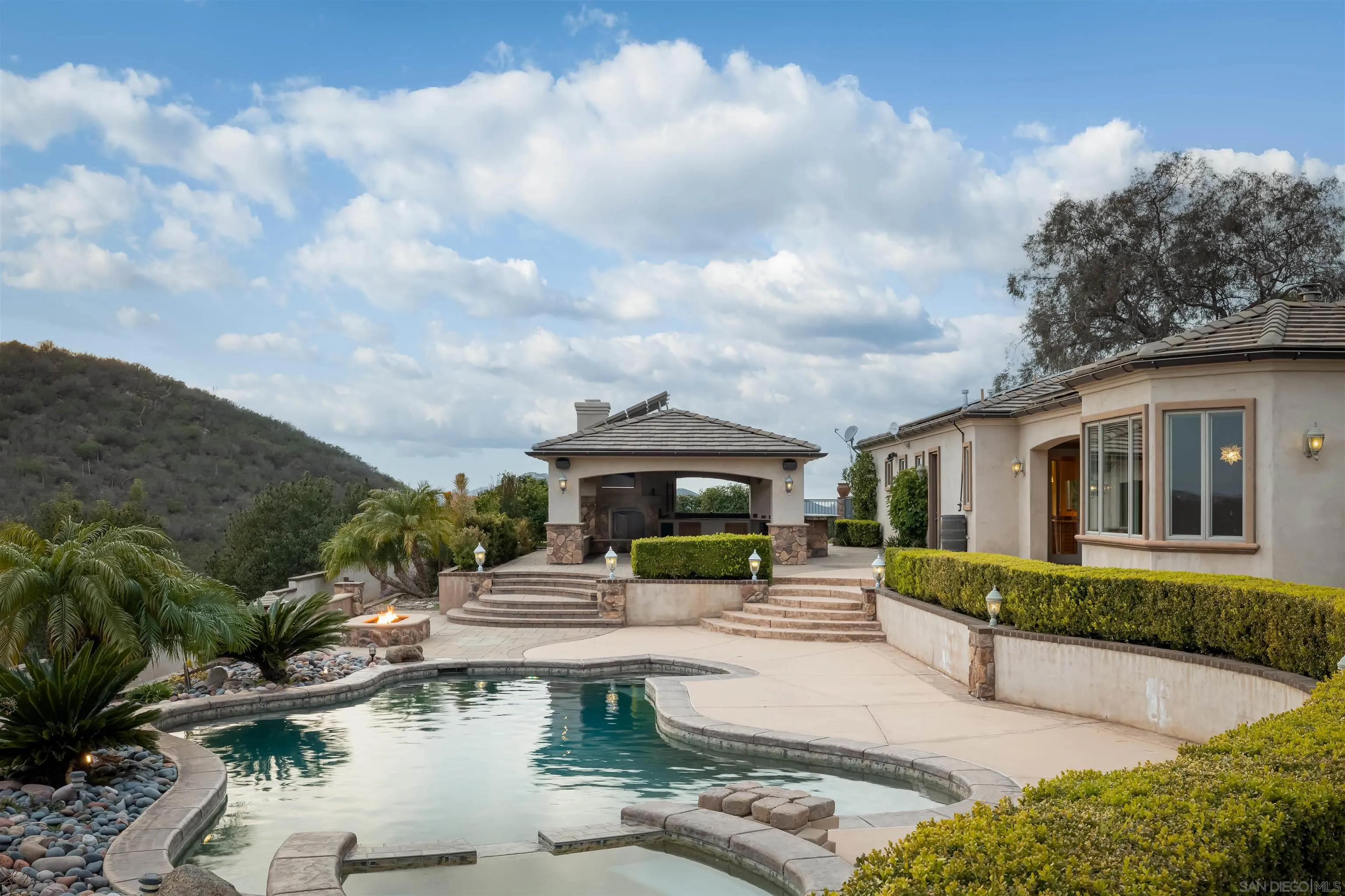 14755 High Valley Road Poway, CA 92064 - Photo 40 of 59 a front view of a house with garden