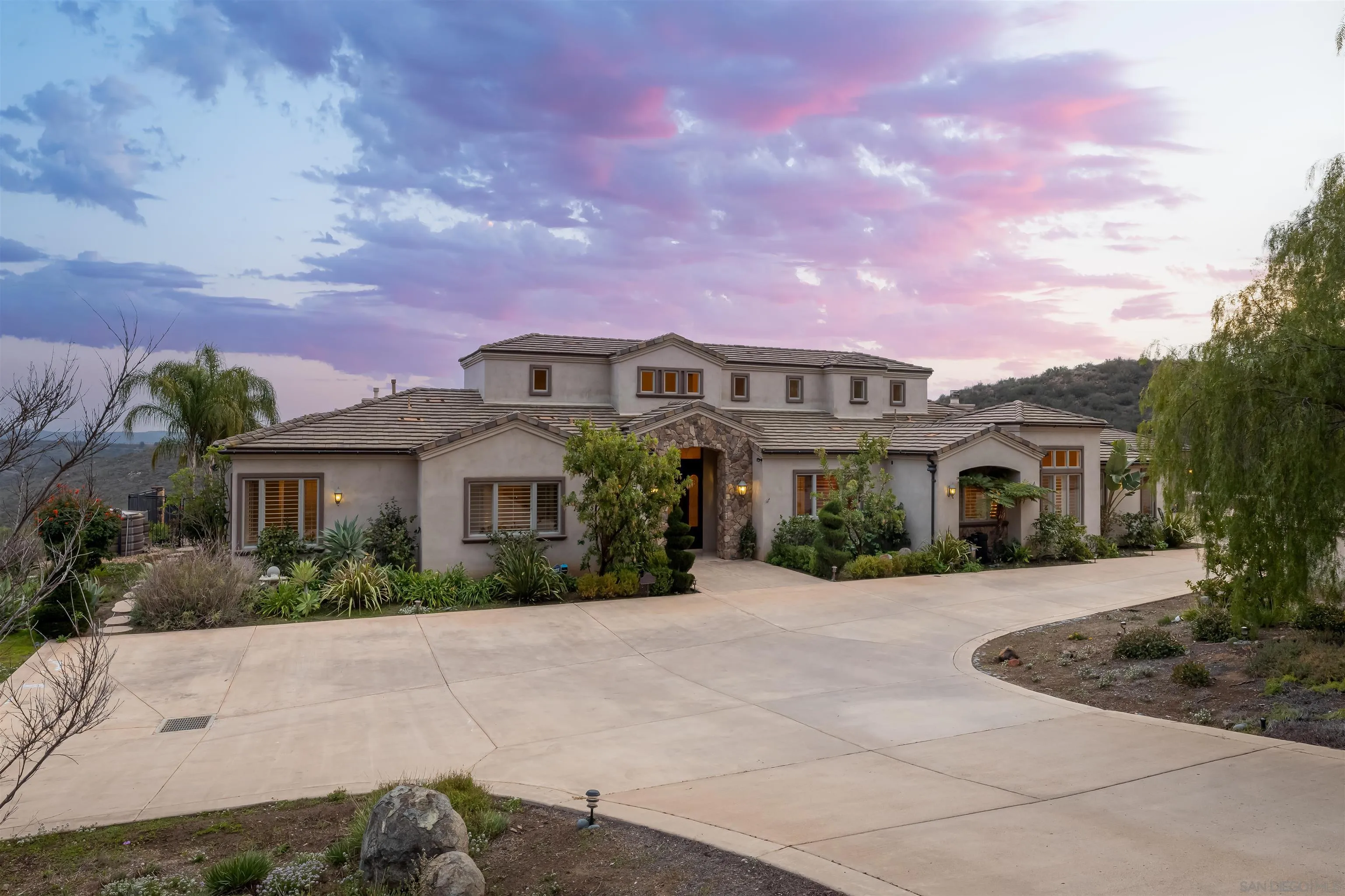 14755 High Valley Road Poway, CA 92064 - Photo 45 of 59 a front view of a house with a yard and trees