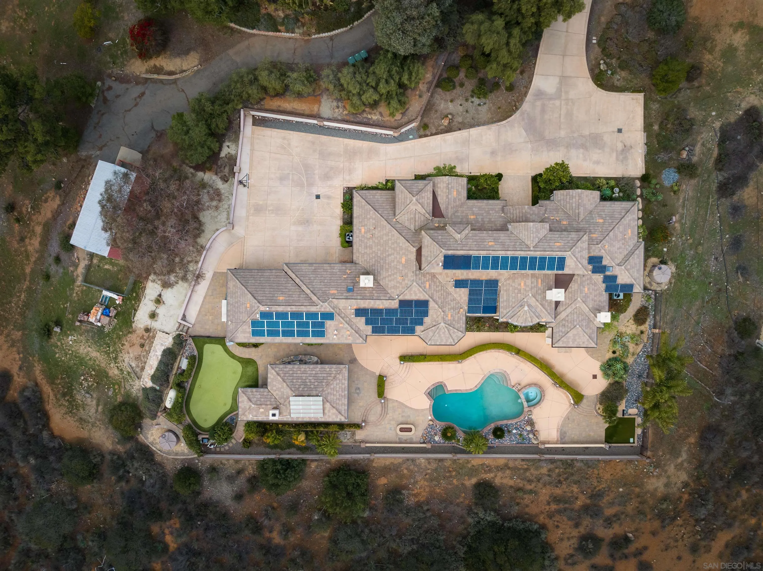 14755 High Valley Road Poway, CA 92064 - Photo 48 of 59 an aerial view of a house with a yard and potted plants