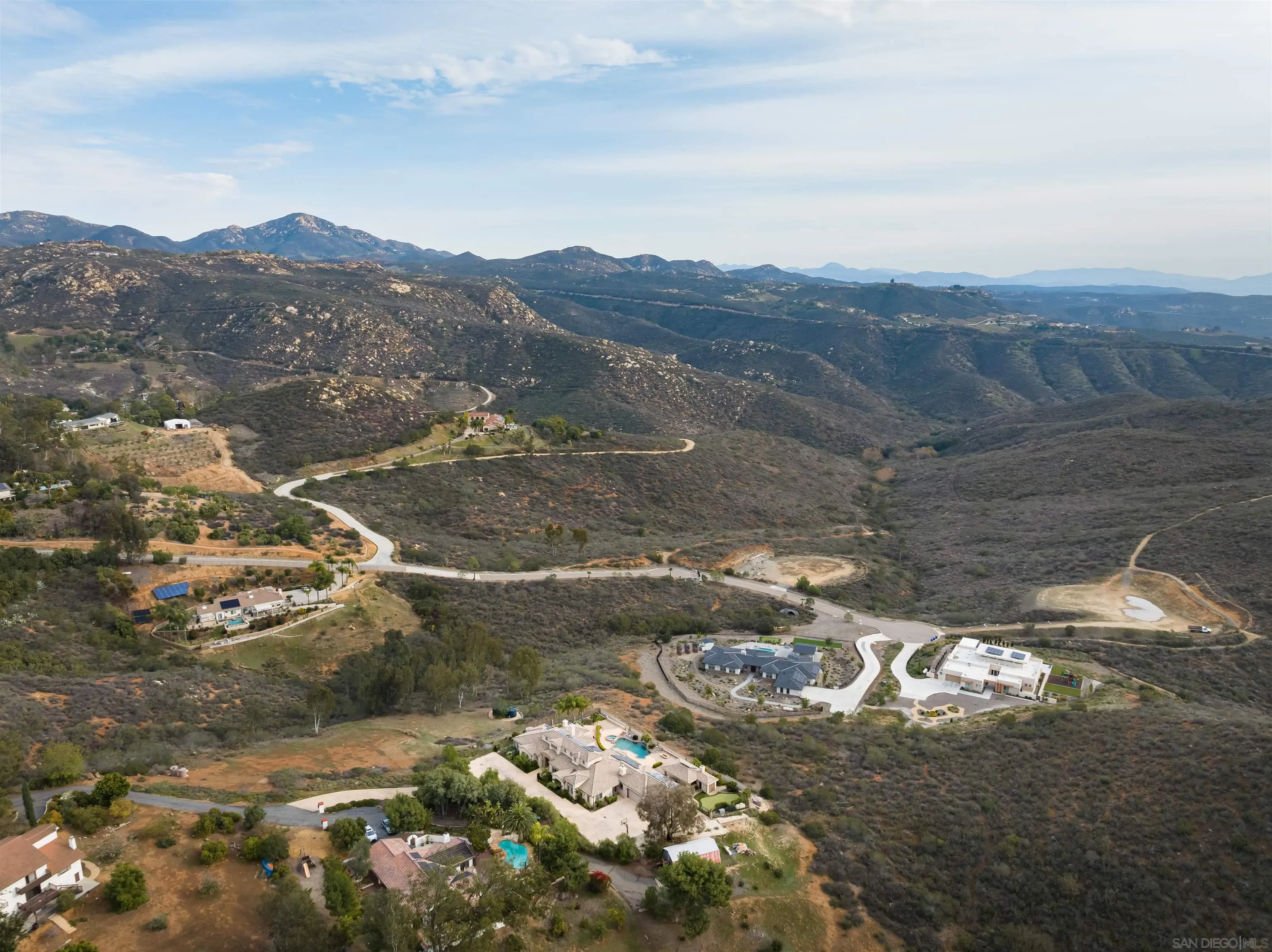14755 High Valley Road Poway, CA 92064 - Photo 56 of 59 a view of a street with mountains in the background