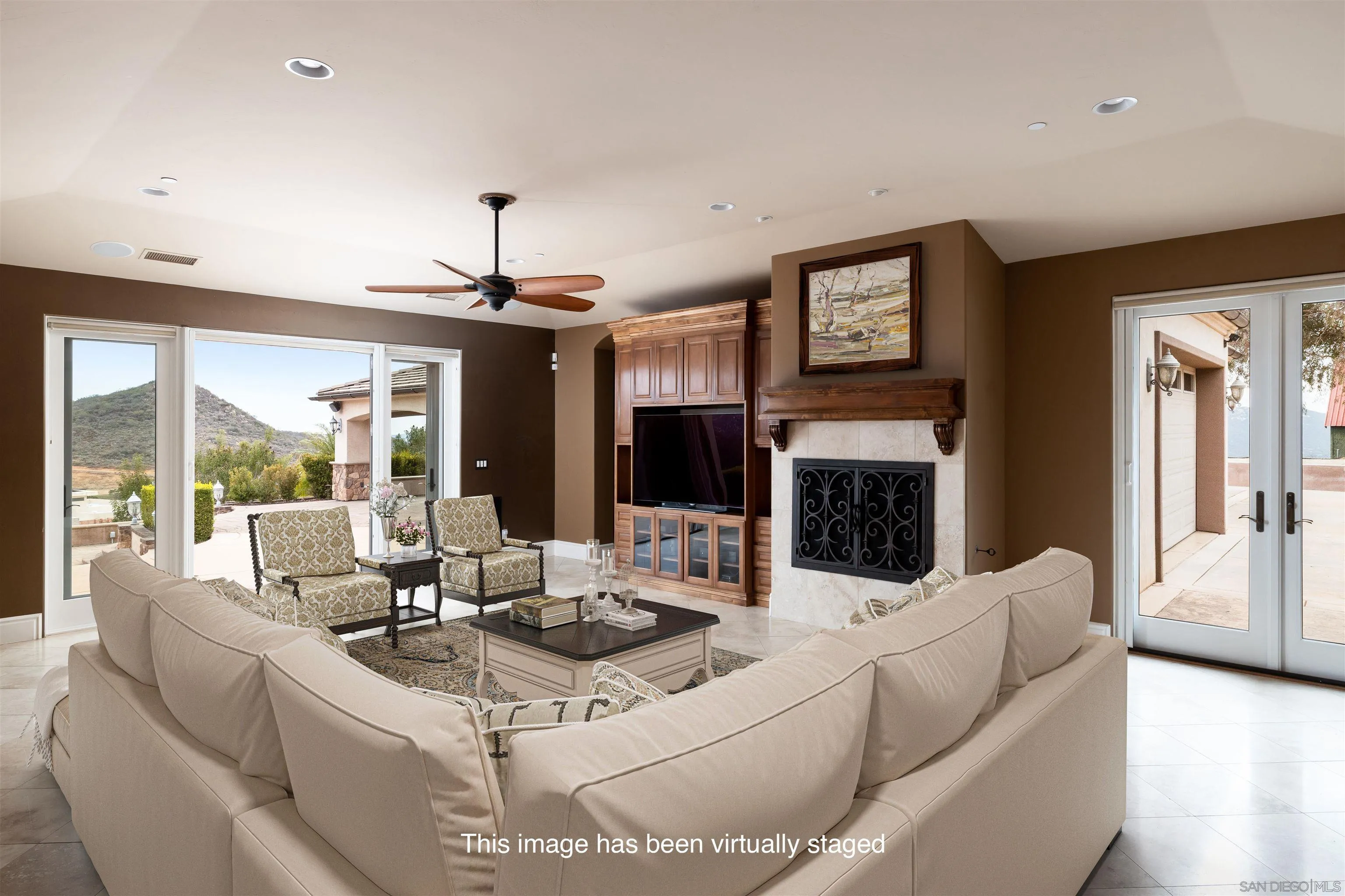 14755 High Valley Road Poway, CA 92064 - Photo 10 of 59 a living room with furniture a fireplace and a large window