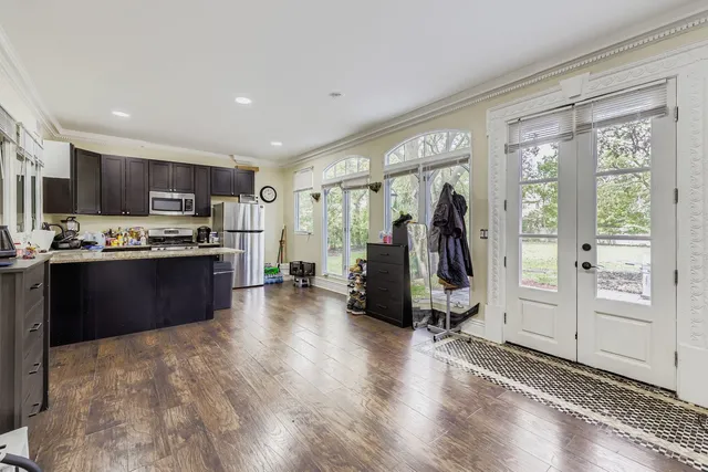a kitchen with refrigerator and cabinets