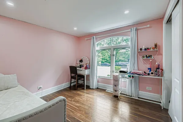 a livingroom with workspace and a window