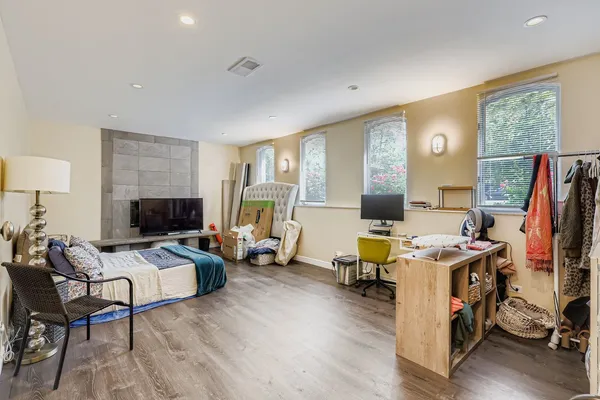 a view of a livingroom with furniture and a flat screen tv