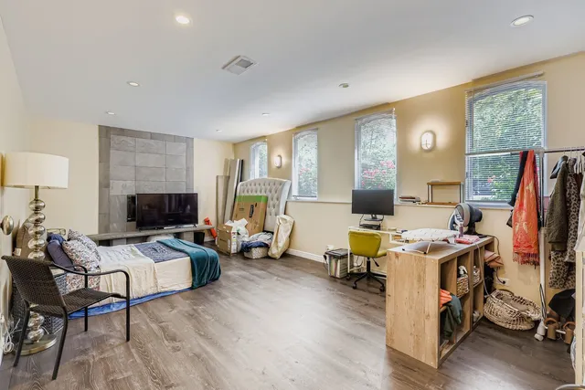a view of a livingroom with furniture and a flat screen tv