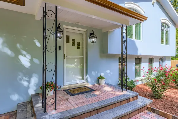 a front view of a house with garden