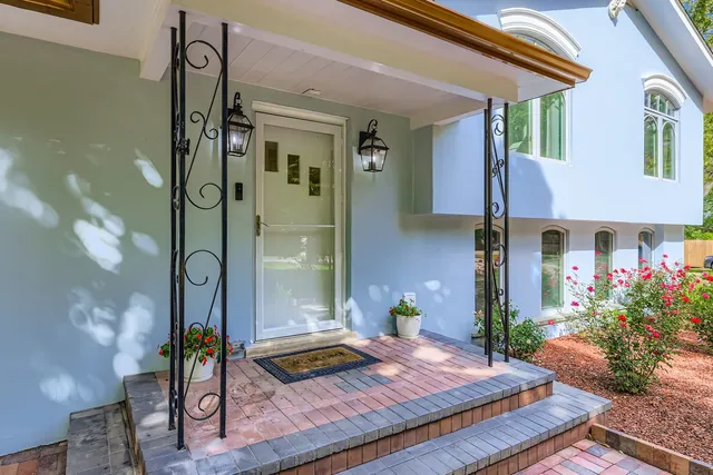 a front view of a house with garden