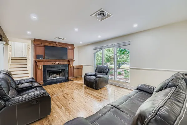 a living room with furniture and a fireplace