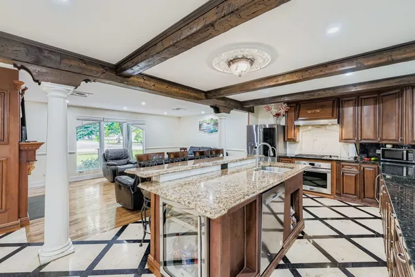 a kitchen with a stove a refrigerator and wooden cabinets