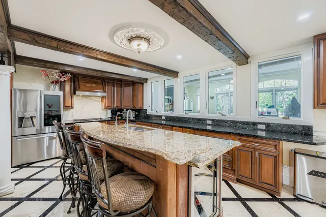 a kitchen with a table and chairs in it