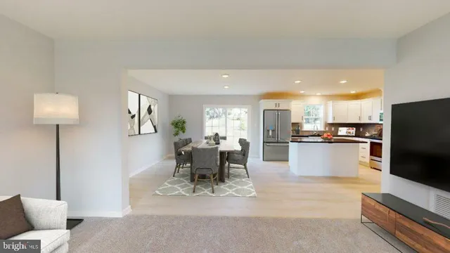 a kitchen with a sink refrigerator and cabinets