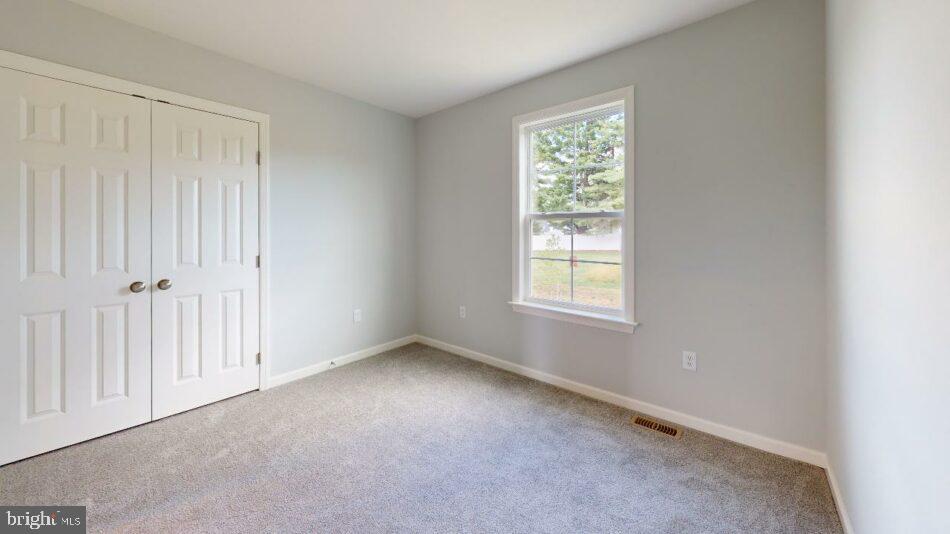 0 Marys Way, Unit EDISON Harrisburg, PA 17112 - Photo 9 of 19 an empty room with windows