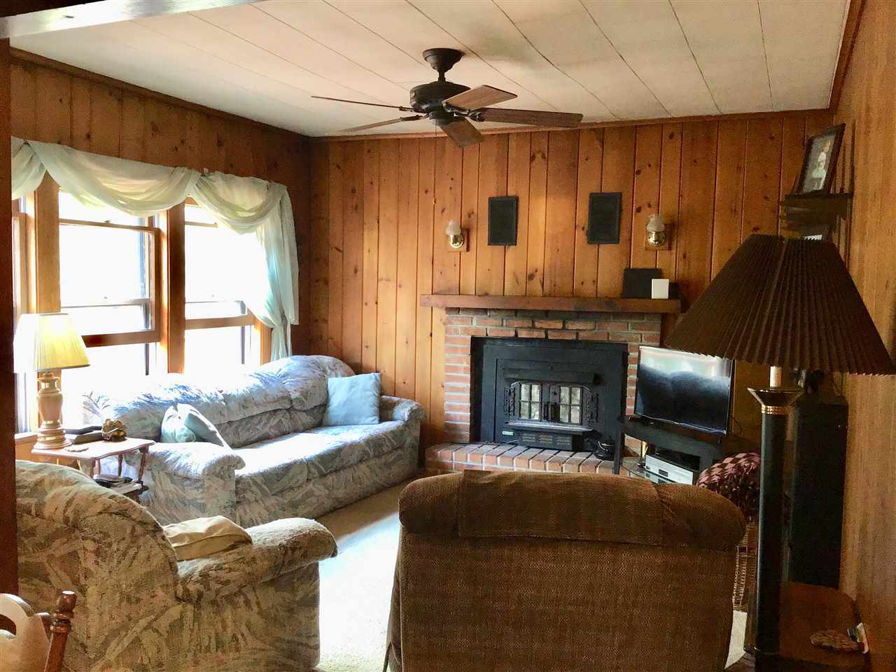 504 West Cunningham Road Winnebago, IL 61088 - Photo 11 of 25 a living room with furniture and a fireplace