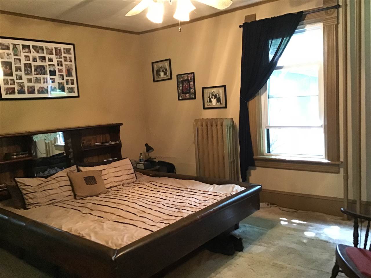 504 West Cunningham Road Winnebago, IL 61088 - Photo 12 of 25 a bedroom with a bed and window