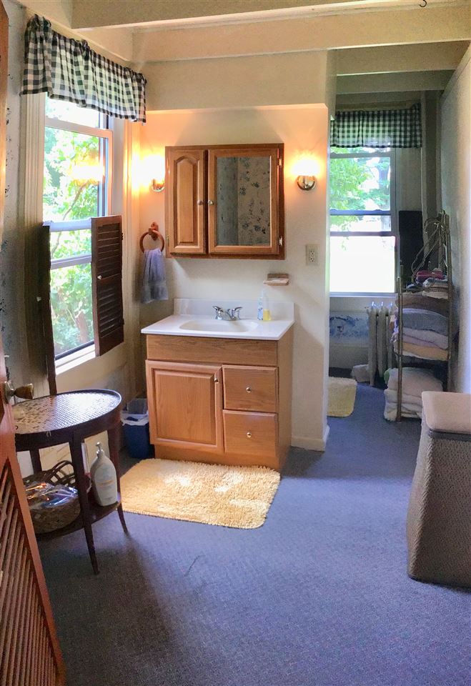 504 West Cunningham Road Winnebago, IL 61088 - Photo 17 of 25 a spacious bathroom with a tub sink and mirror