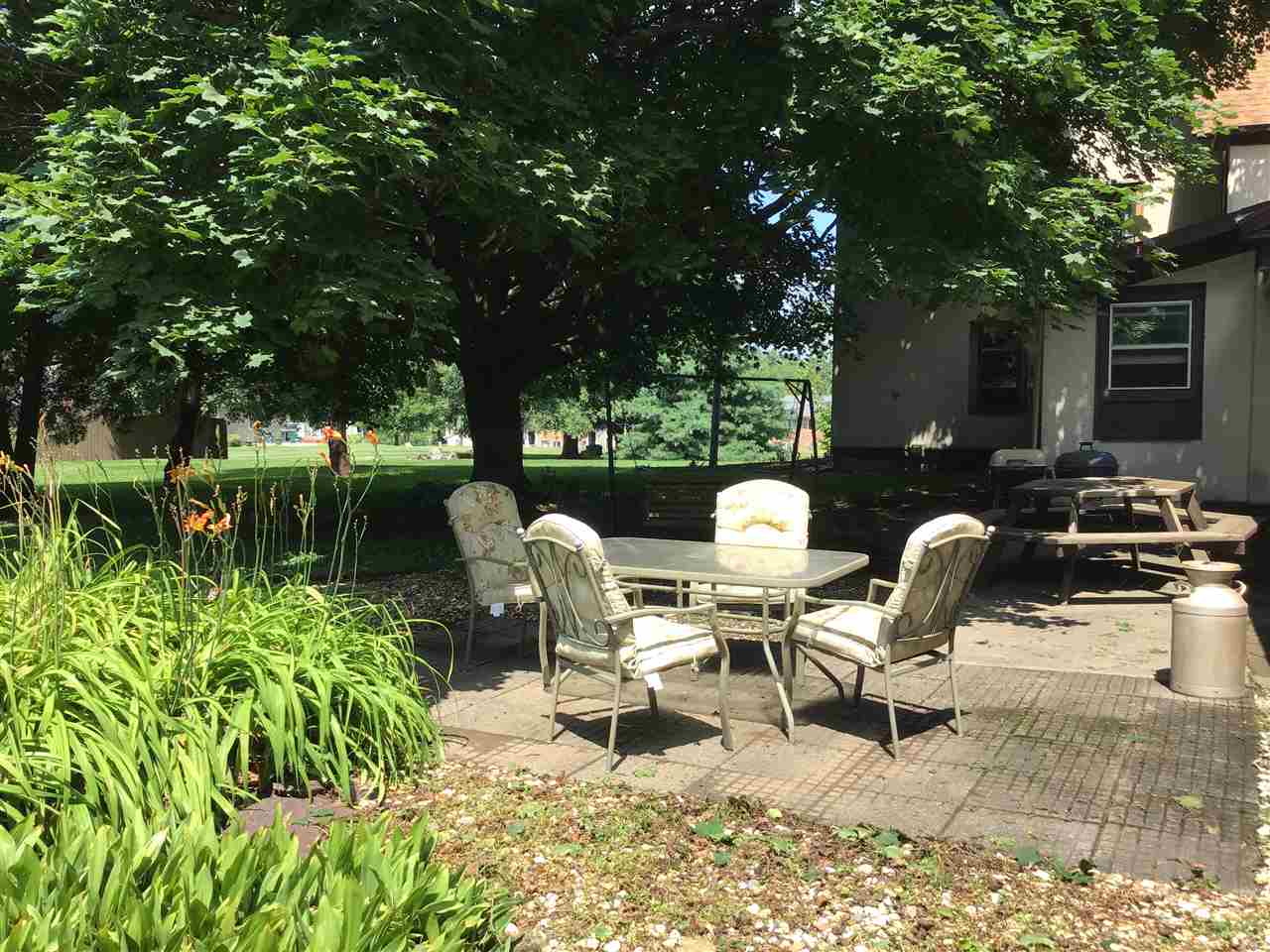 504 West Cunningham Road Winnebago, IL 61088 - Photo 21 of 25 a backyard of a house with outdoor seating