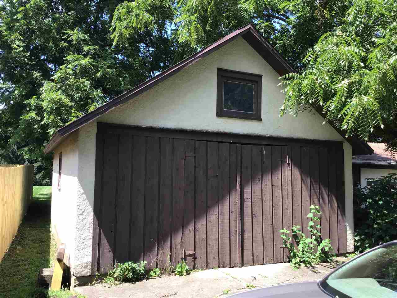 504 West Cunningham Road Winnebago, IL 61088 - Photo 22 of 25 a backyard of a house with plants and trees
