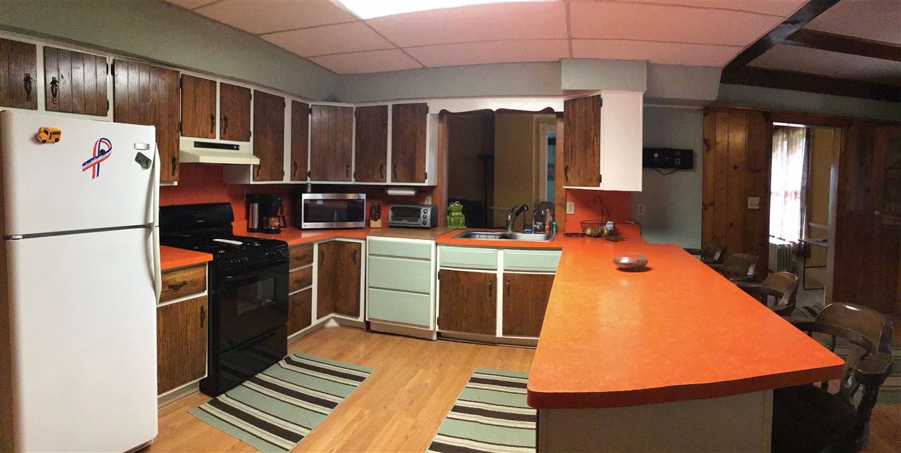 504 West Cunningham Road Winnebago, IL 61088 - Photo 7 of 25 a kitchen with refrigerator and cabinets