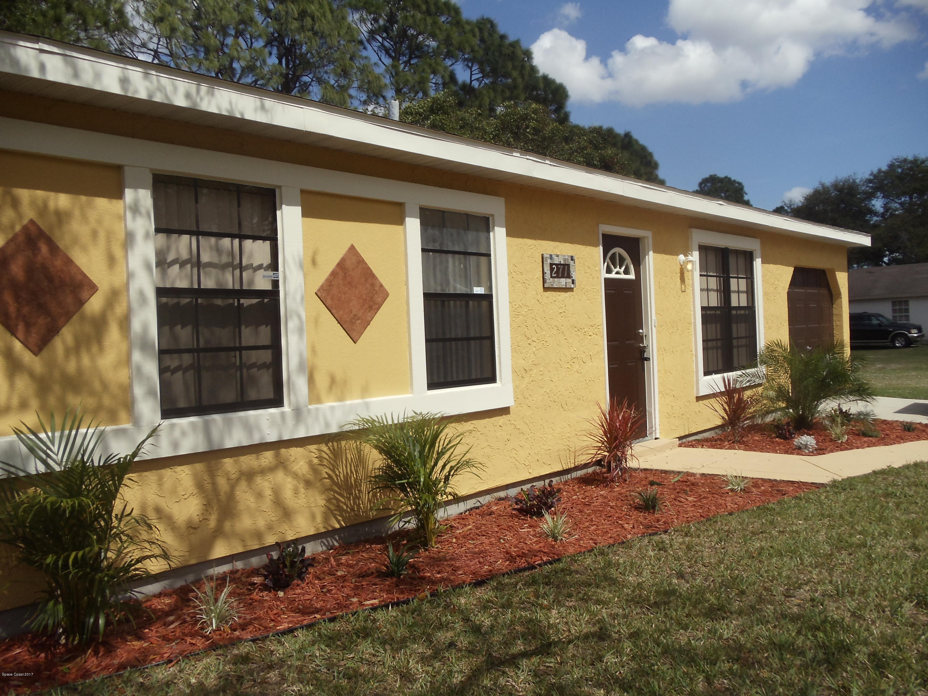 271 Trilby Road Southwest Palm Bay, FL 32908 - Photo 2 of 27 a front view of a house