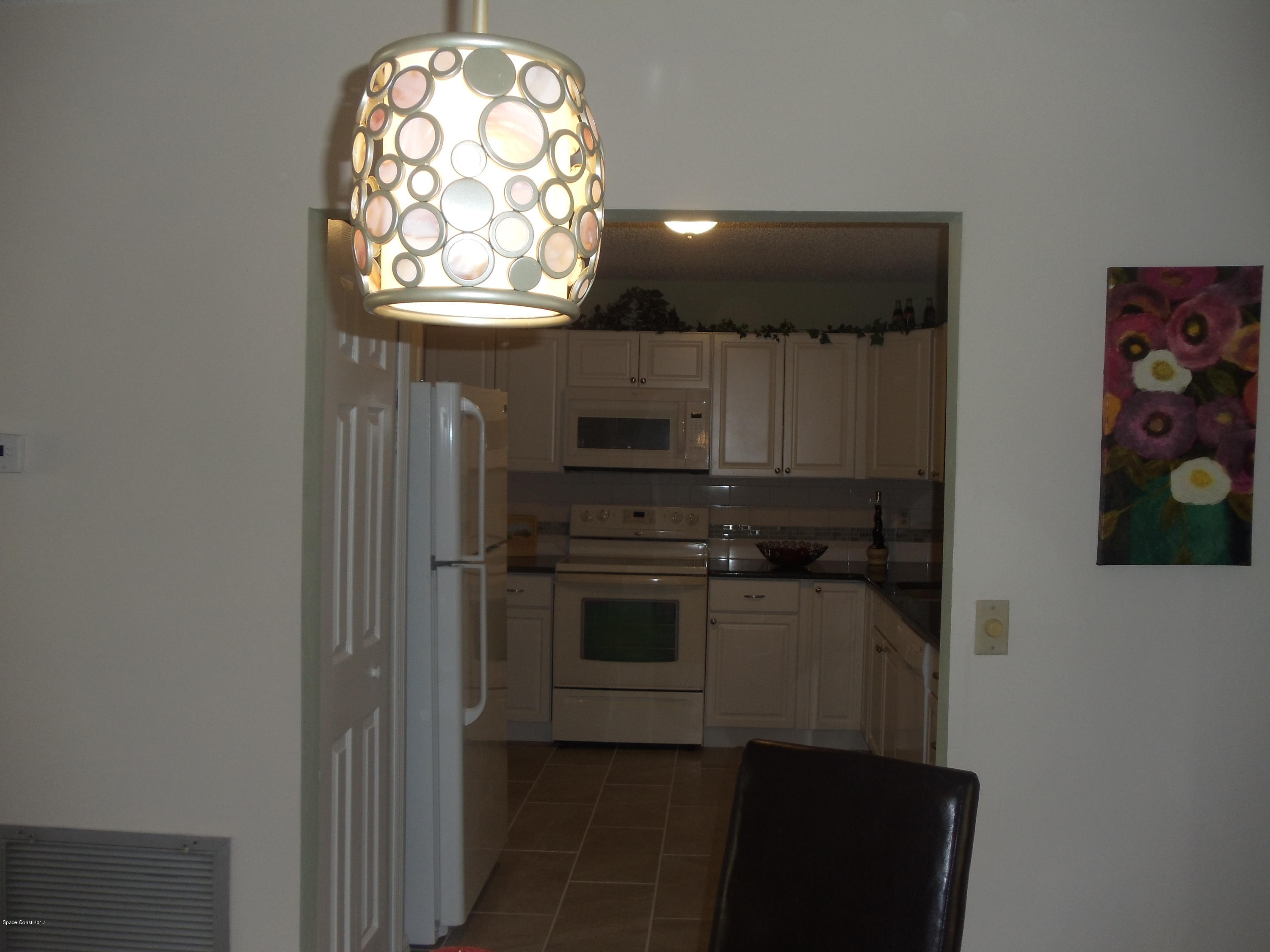271 Trilby Road Southwest Palm Bay, FL 32908 - Photo 16 of 27 en suite bathroom with a sink and a mirror