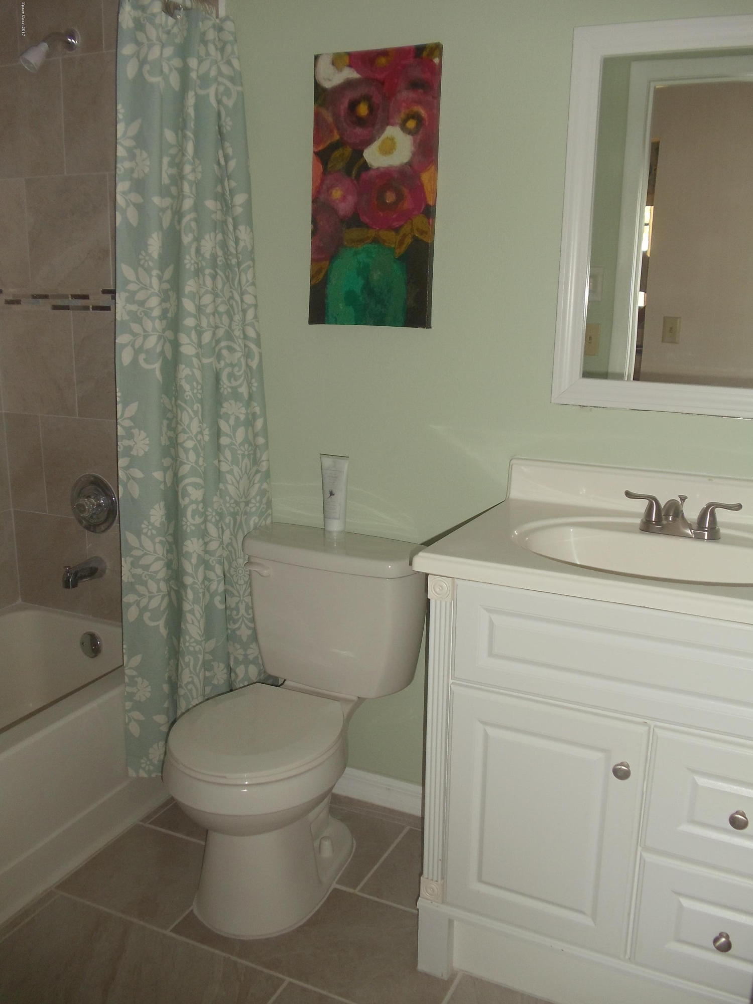 271 Trilby Road Southwest Palm Bay, FL 32908 - Photo 19 of 27 a bathroom with a toilet sink and shower