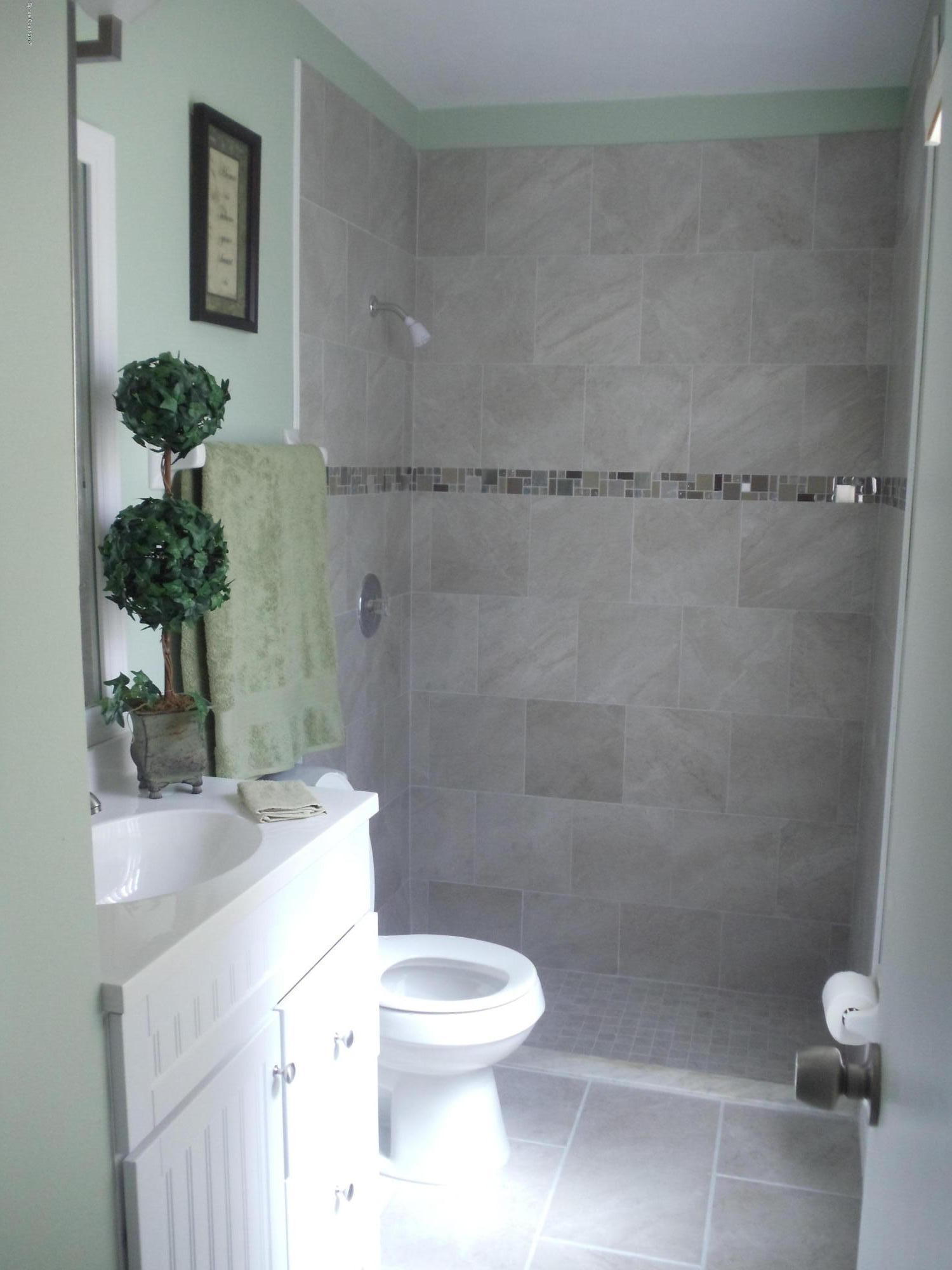 271 Trilby Road Southwest Palm Bay, FL 32908 - Photo 21 of 27 a bathroom with a sink a toilet and shower