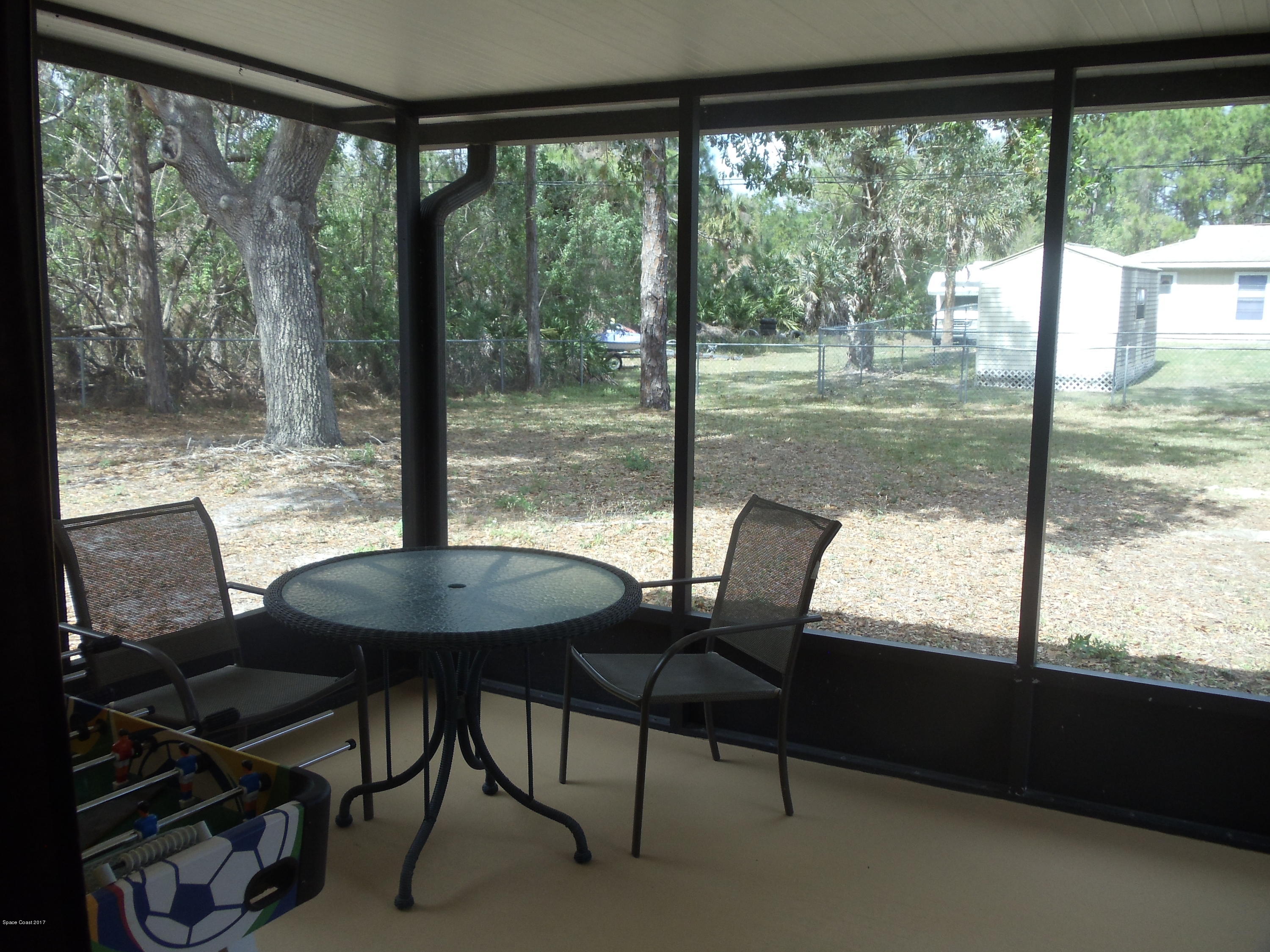 271 Trilby Road Southwest Palm Bay, FL 32908 - Photo 23 of 27 a view of a room with a table and chairs