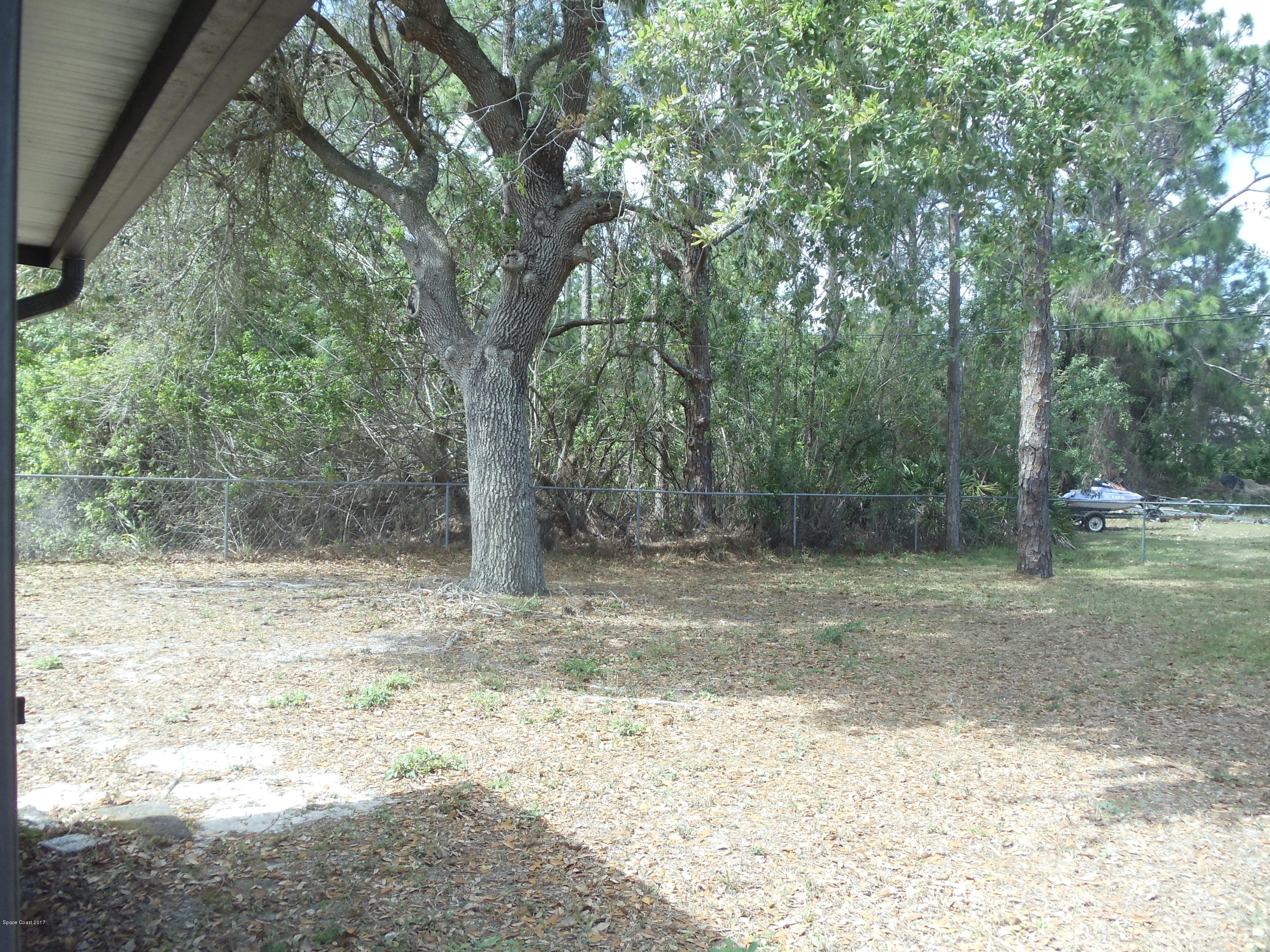 271 Trilby Road Southwest Palm Bay, FL 32908 - Photo 26 of 27 a view of a yard with a tree
